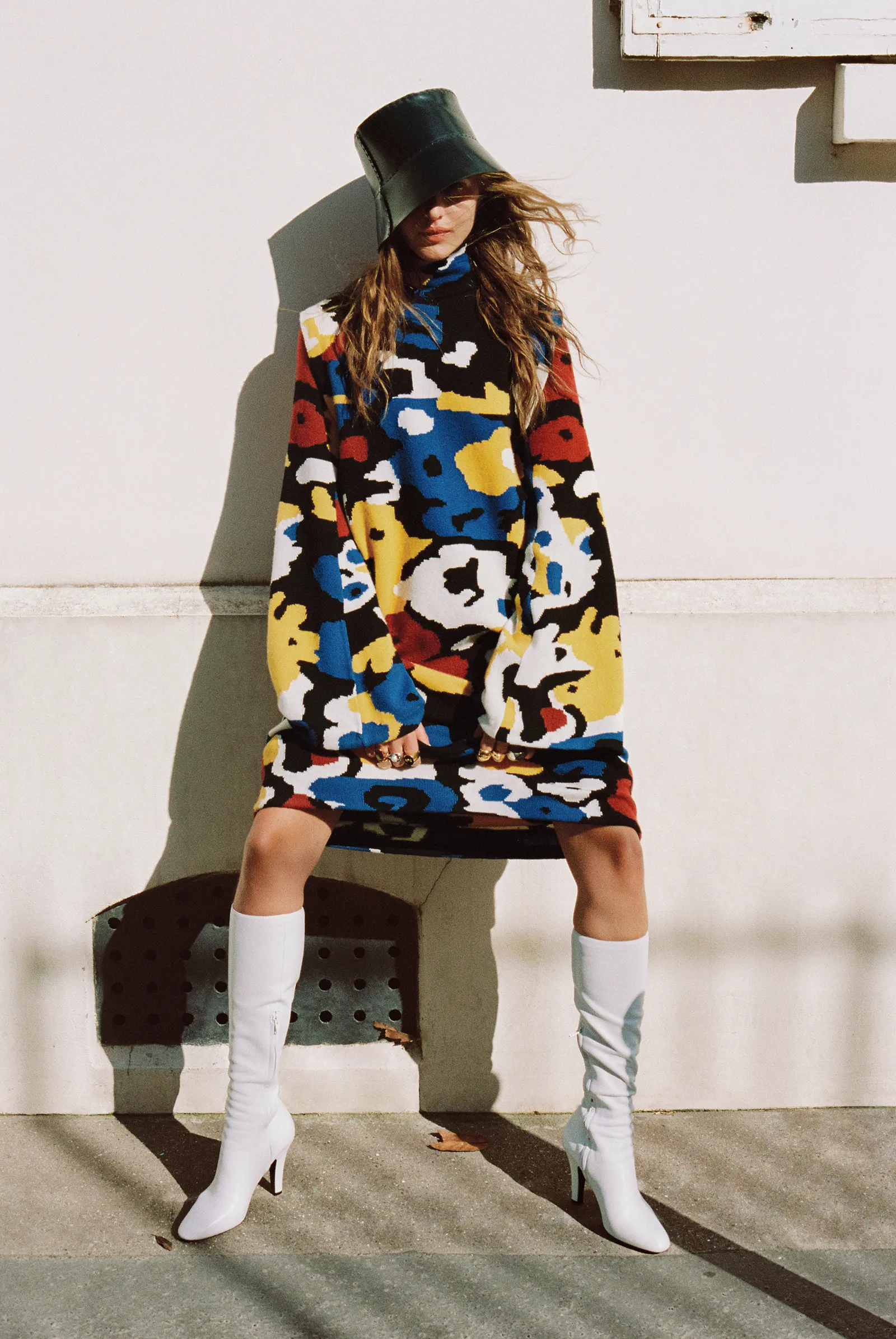 Image may contain Christelle Lefranc Clothing Coat Adult Person Dress Knitwear and Sweater
