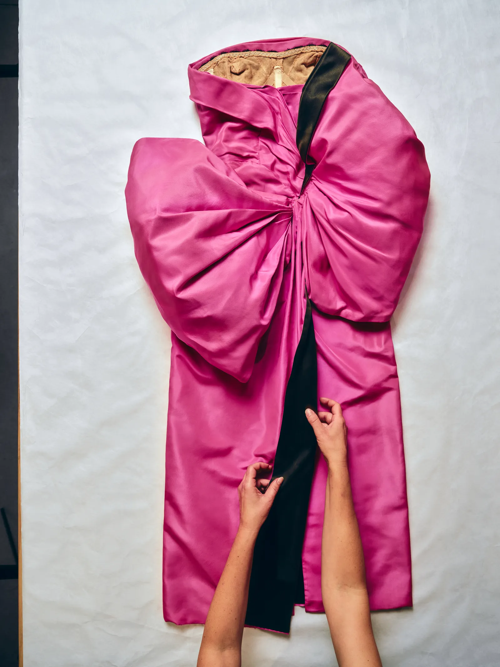 Image may contain Fashion Clothing Coat Robe Adult Person and Cape