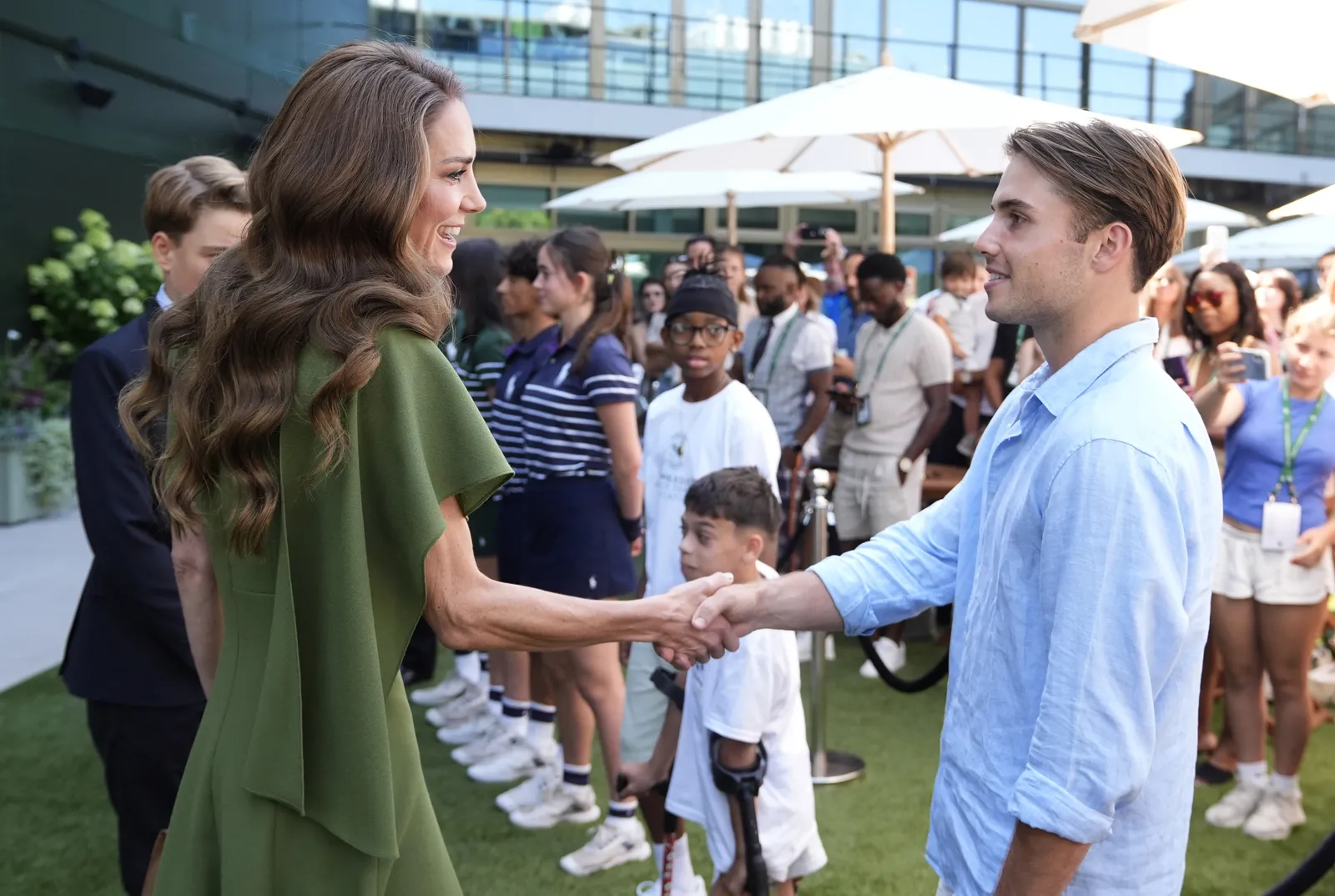 LONDON ENGLAND  JULY 12 Catherine Princess of Wales meets semifinalist Arthur Fery as she arrives to Center Court for...