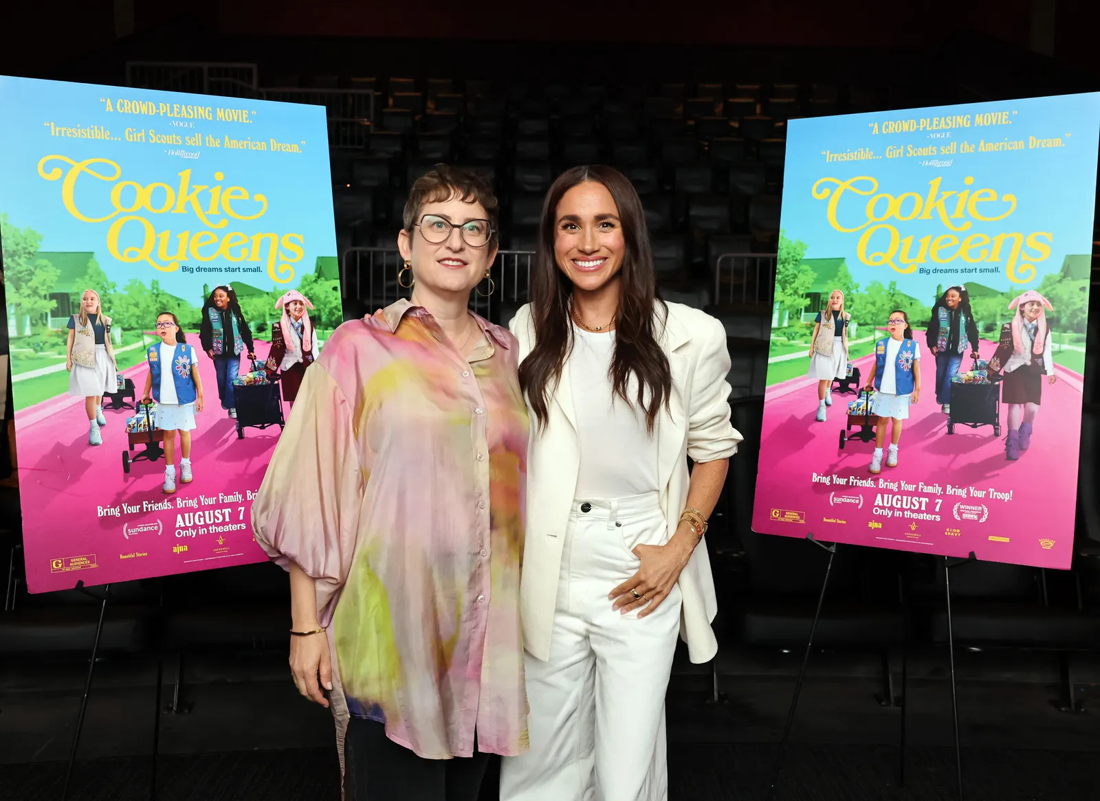 Image may contain Meghan Duchess of Sussex Marla Frazee Person Photobombing Blouse Clothing Adult and Accessories