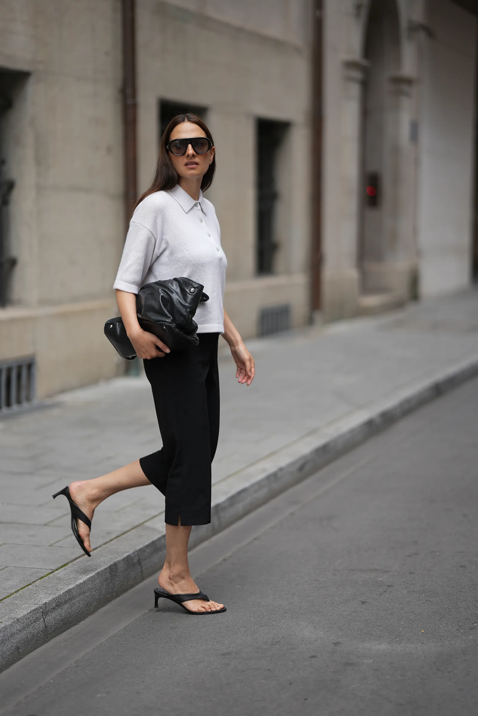 MUNICH GERMANY  JUNE 16 Anna Winter is seen wearing a white cashmere polo shirt from Allude black capri trousers from...