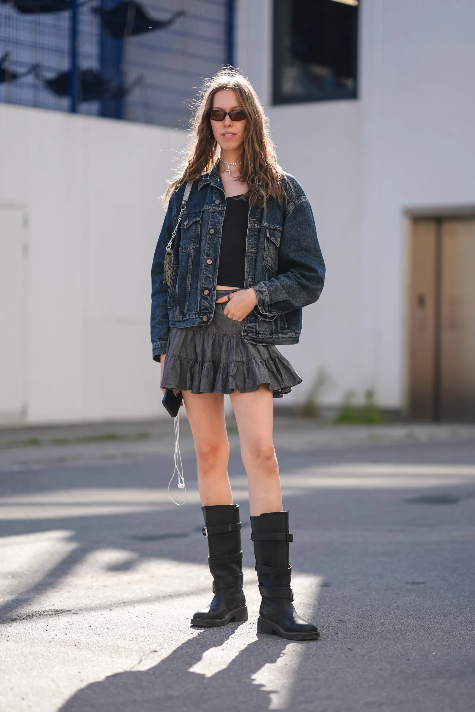 Image may contain Person Teen Clothing Footwear Shoe Accessories Glasses Coat Jacket Jewelry Necklace and Skirt