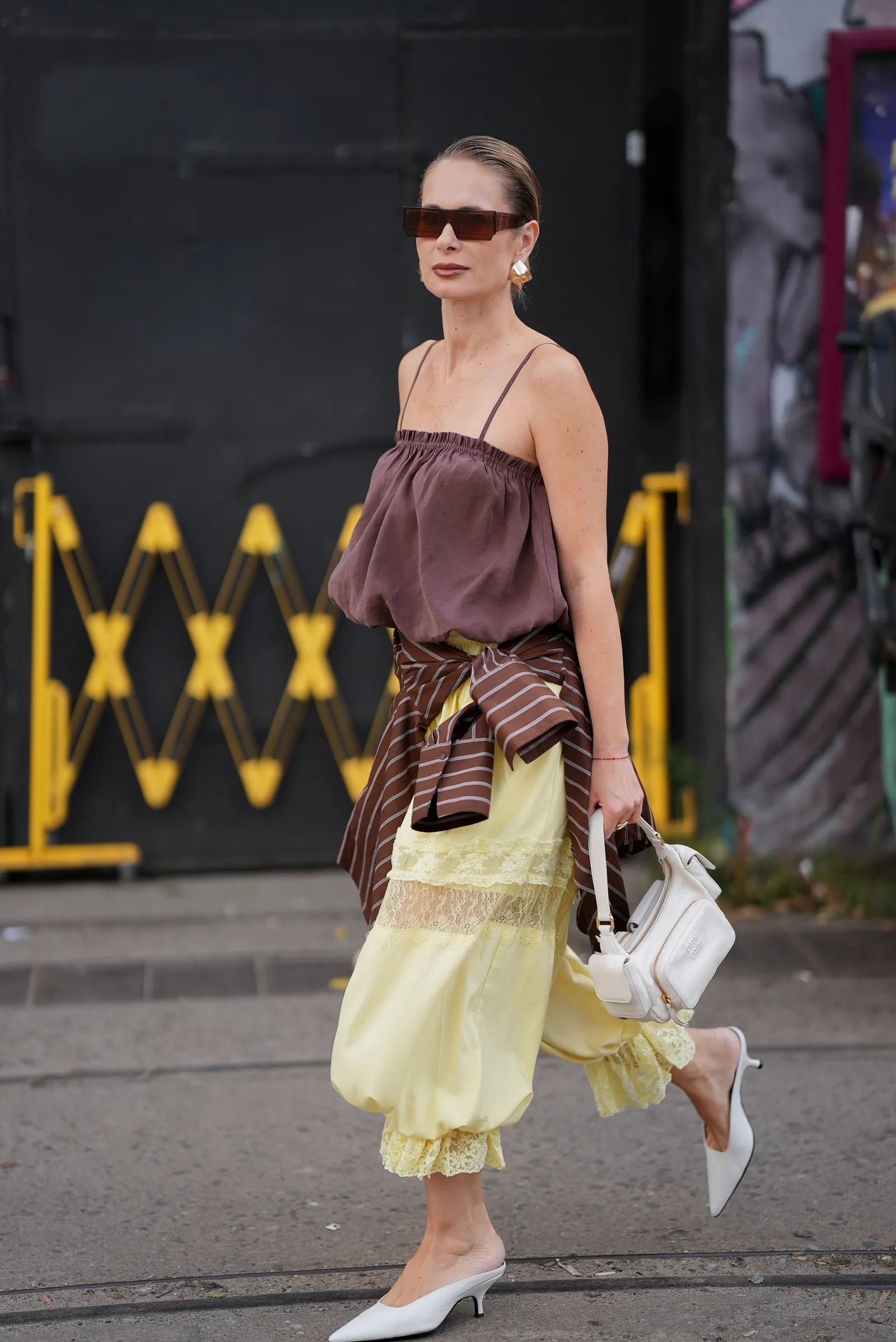 BERLIN GERMANY  JULY 3 Iryna Thater is seen wearing a brown gathered camisole top from Zara a dark brown and white...